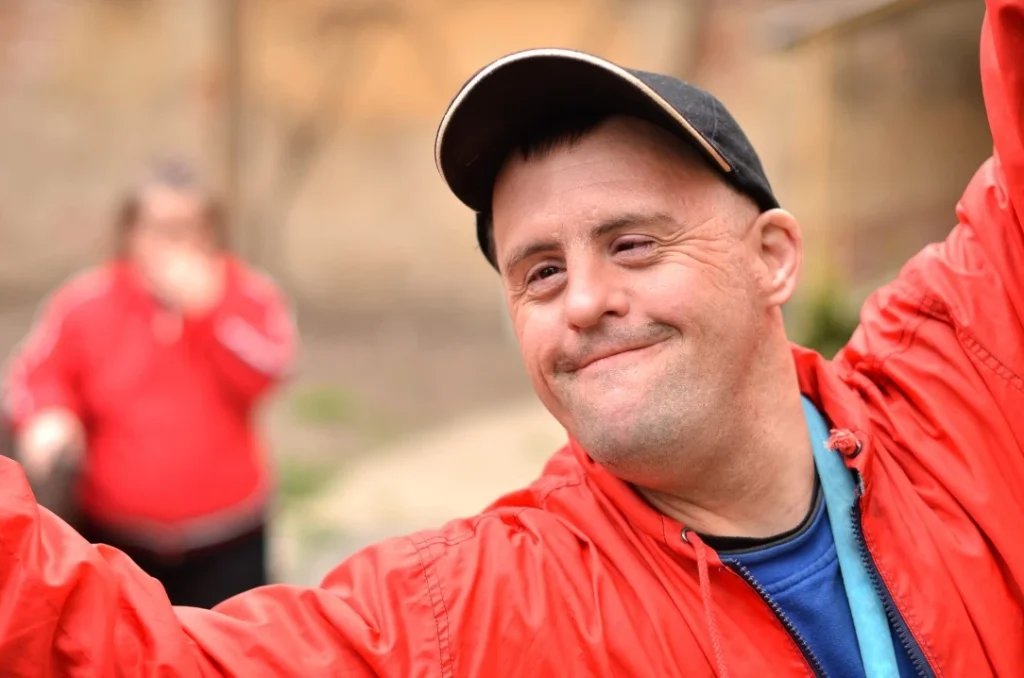 Happy disabled man smiling at the camera
